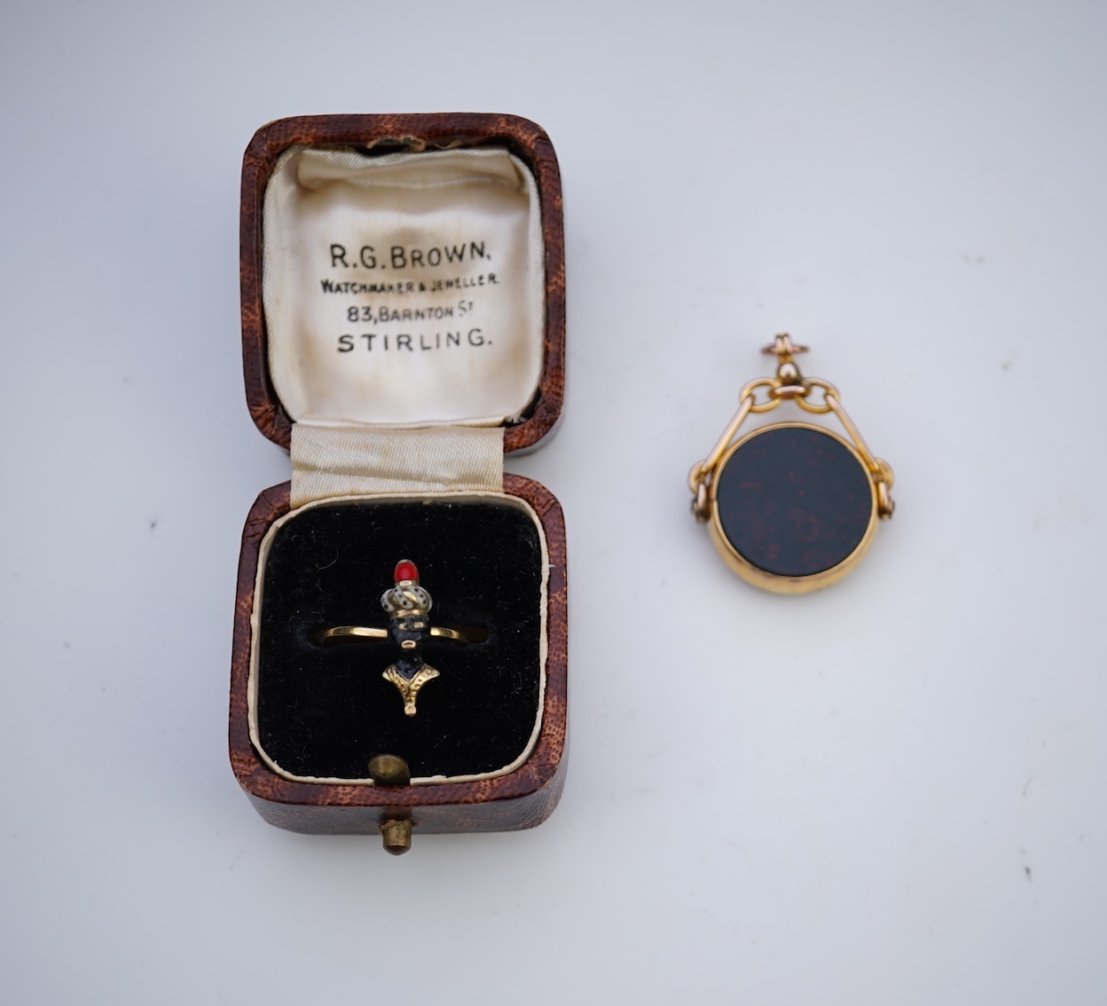 An enamel ring and a hardstone swivel fob seal